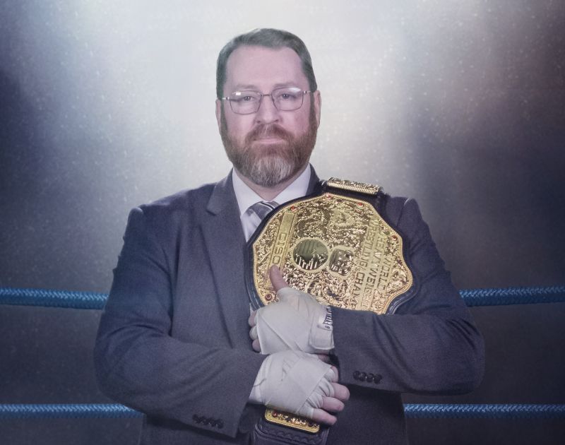 Jonathan Kimmitt holding the belt