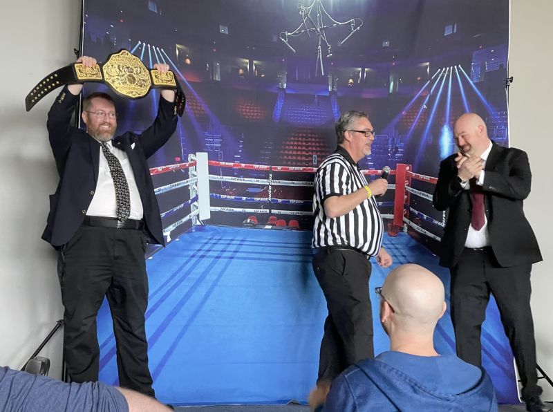 On stage: a champion raises the belt